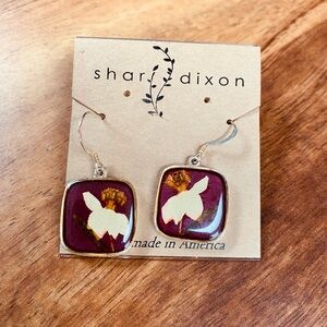 Shari Dixon handmade pressed flower earrings. Narcissus= December birth flower.